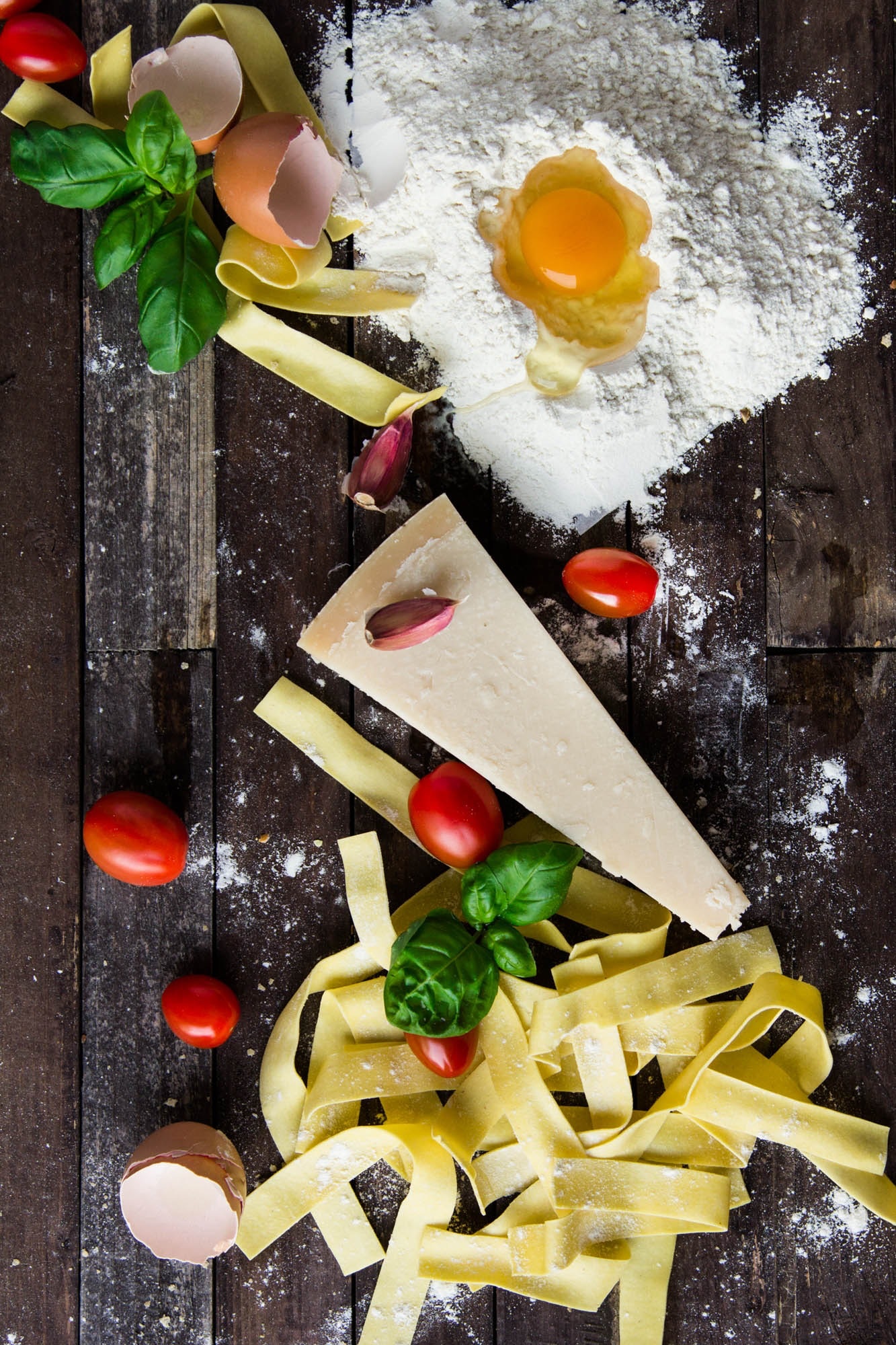 pasta-tomatoes-and-flour-with-egg-shells-on-table-35661
