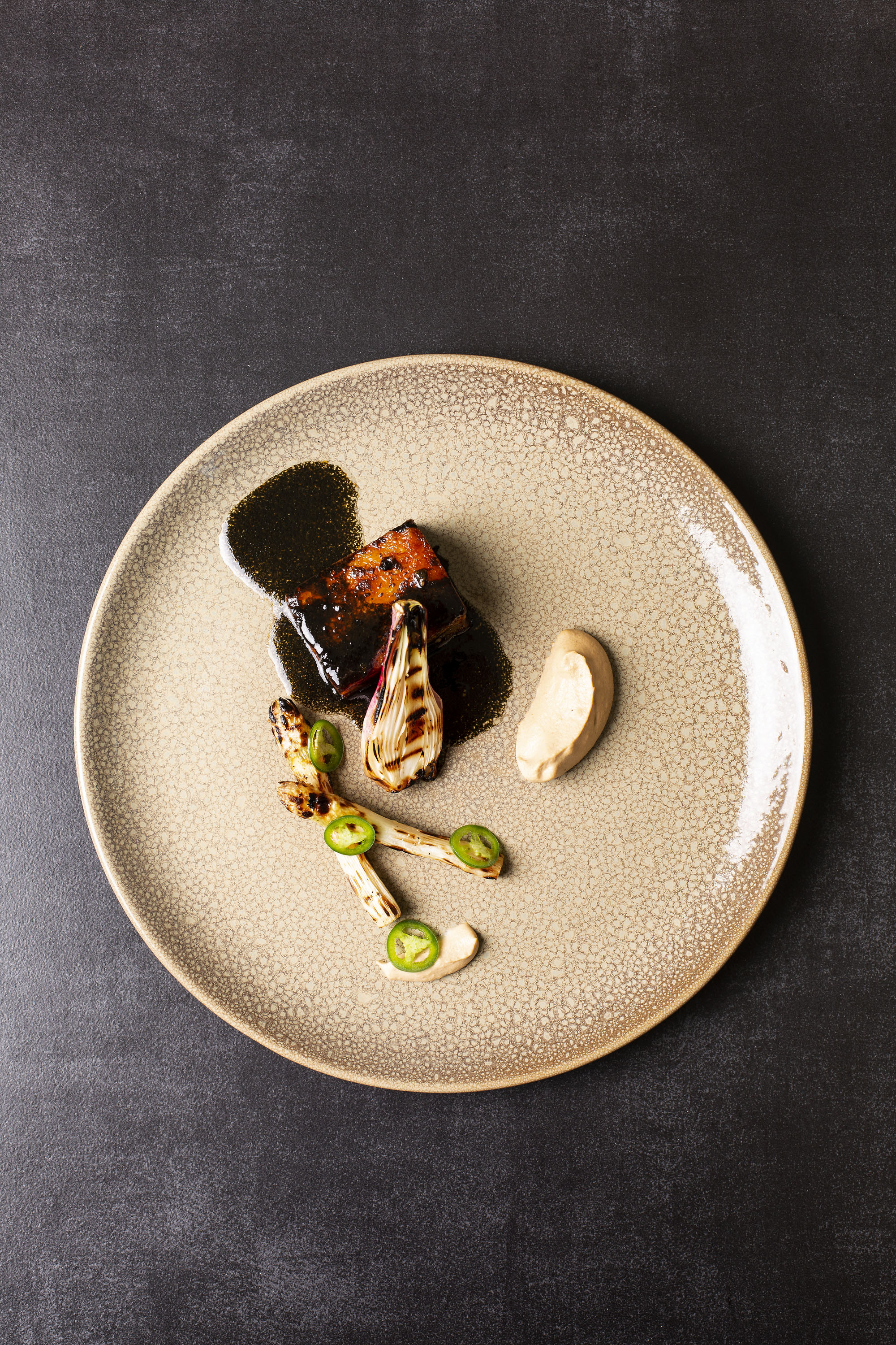 Basalt- Mexican Inspired Pork Belly with Ricarda Negra, charred asparagus &amp; toasted almond mole (HR) 2 photo Annalize Nel
